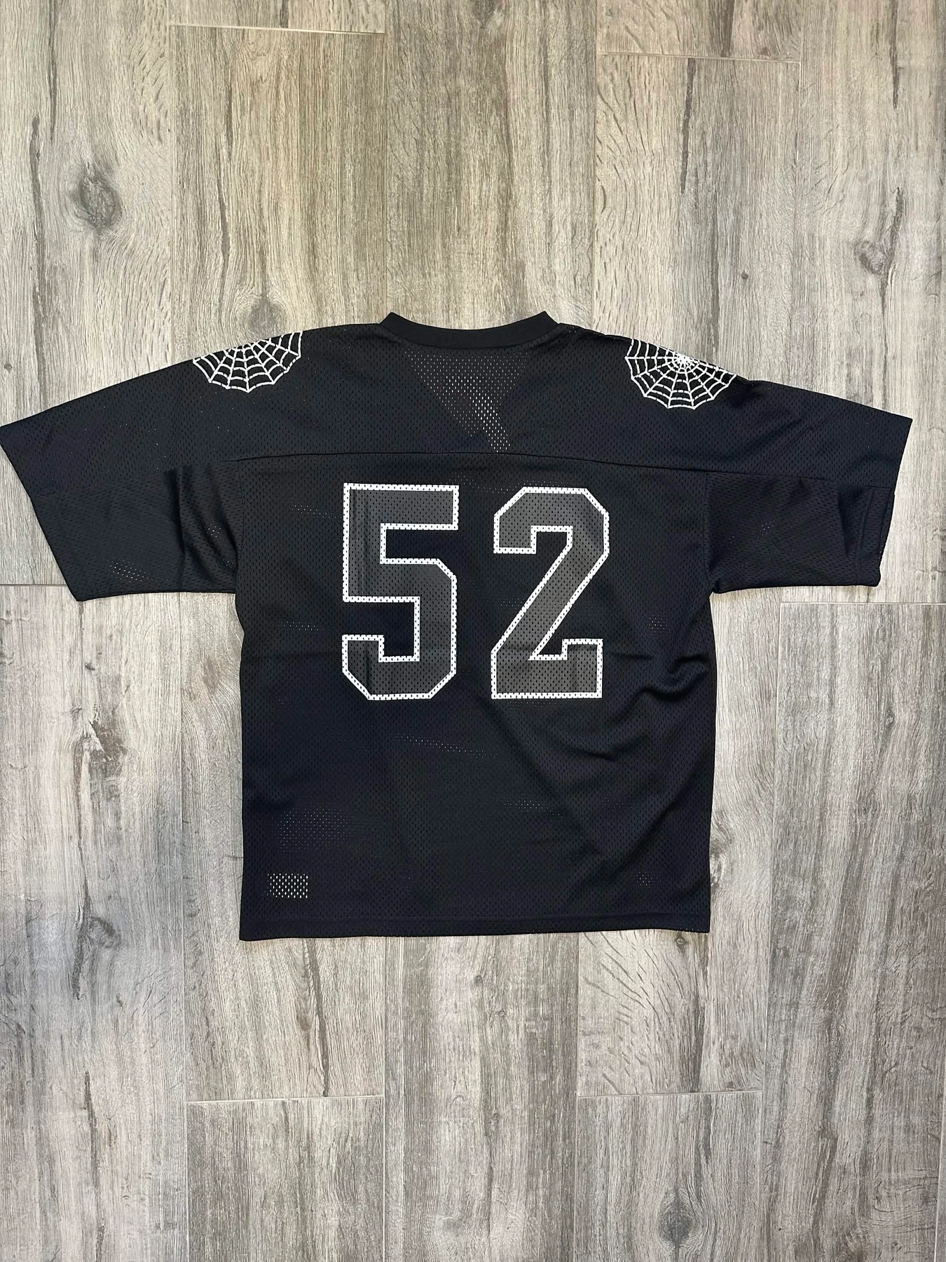 الجزء الخلفي من قميص Supreme 52