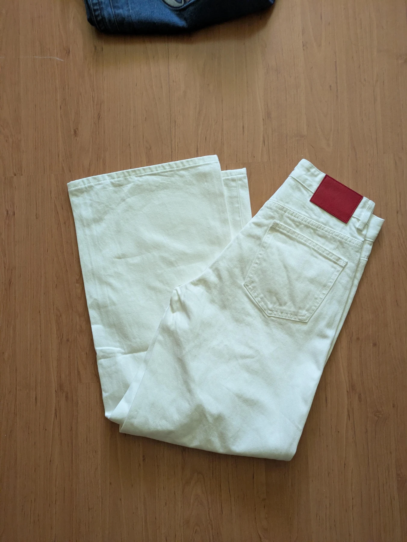 Waist and label view of the light jeans