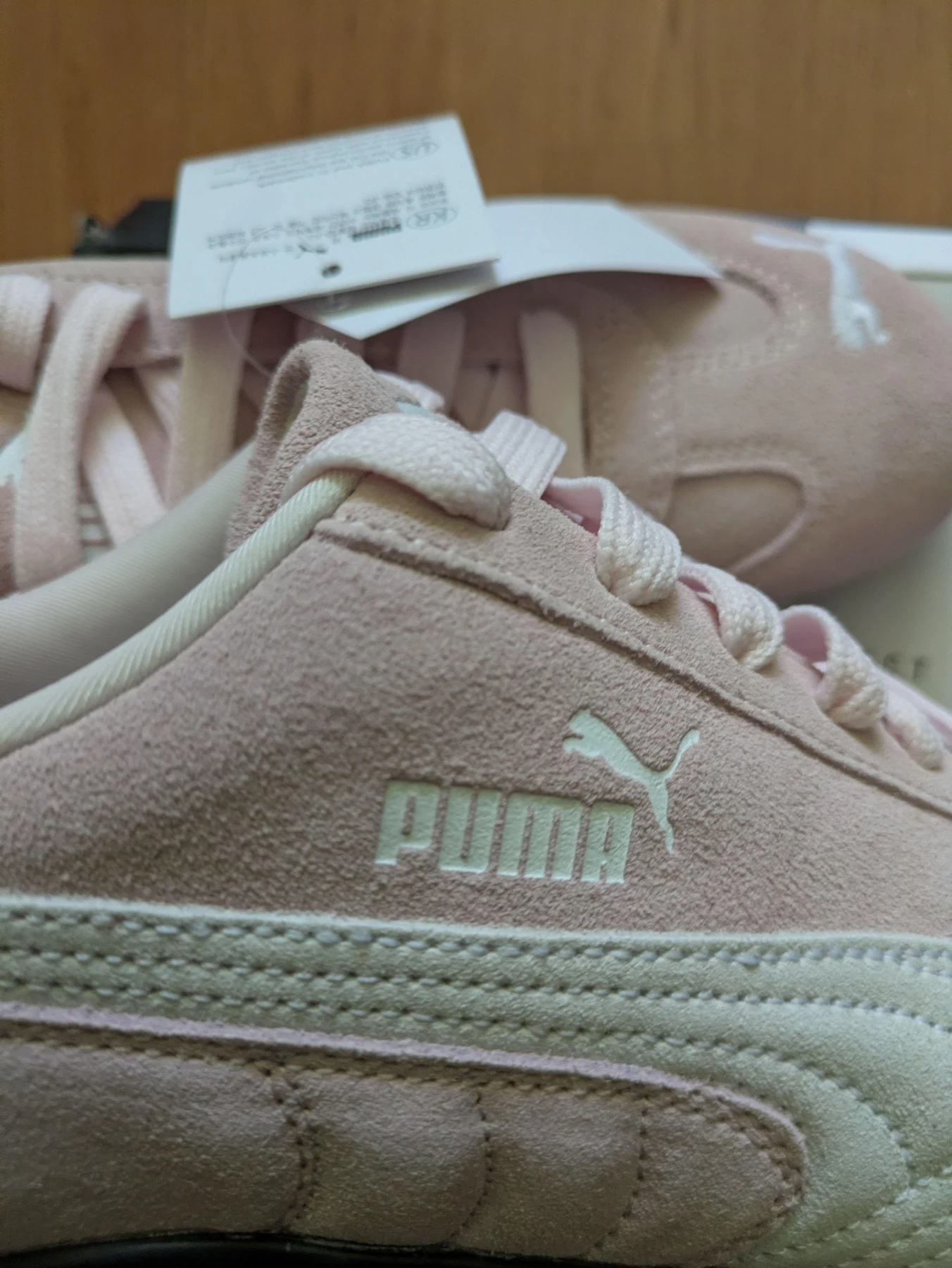 Close-up of the Puma shoe and label